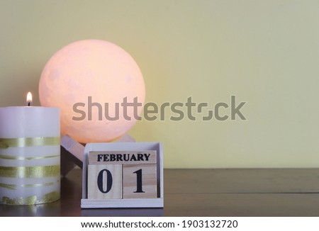 Day 1 of february month, Wooden calendar with date. Empty space for text.
