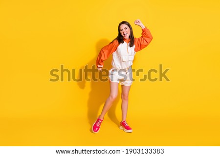 Photo portrait full body view of woman dancing isolated on vivid yellow colored background