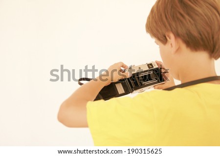 Child with old camera