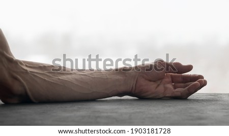 Strongly pronounced healthy veins on the arm of an adult
