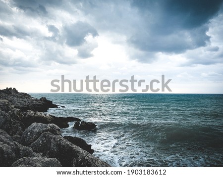 Rocky coastline background, stormy sea view