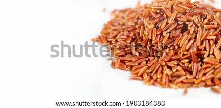  Product photography. Red rice. Brown and white rice contain the same amount of calories and carbohydrates. it is a whole grain and a good source of magnesium, phosphorus, selenium, thiamine 