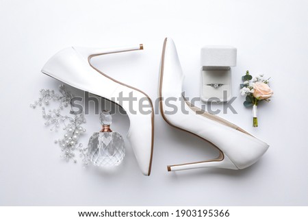 Composition with wedding high heel shoes on white background, top view Royalty-Free Stock Photo #1903195366