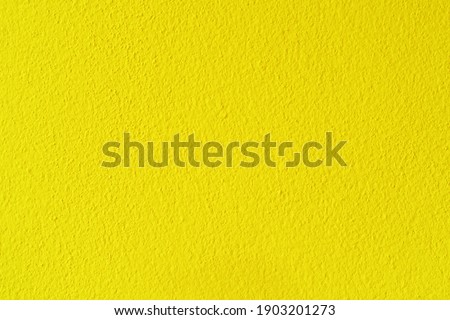 Yellow cement or concrete wall texture background.