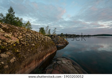 
Dawn on the shores of Lake Ladoga. Republic of Karelia, Russia.
Water surface, skerries