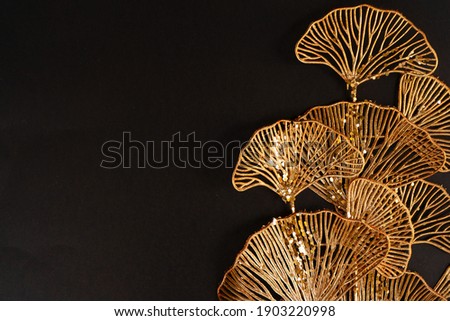Golden tropical flowers on black background, art deco style bakground Royalty-Free Stock Photo #1903220998