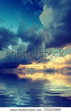 Dramatic sky over the sea during sunset. Vintage picture
