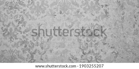Old gray white rusty vintage shabby damask patchwork tiles stone concrete cement wall texture background	