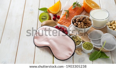 Selection of food for better sleep insomnia rich in tryptophan and melatonin, copy space Royalty-Free Stock Photo #1903305238