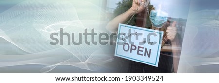 Woman wearing medical face mask hanging come in we're open sign on window; panoramic banner