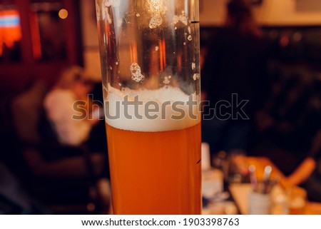 cold beer glass on bar or pub desk.