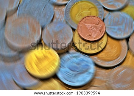 Blurred coins spin use for business and financial concept background