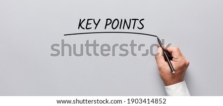 Businessman hand underlining the word key points on gray background. Highlighting the key points of an issue in business concept. Royalty-Free Stock Photo #1903414852