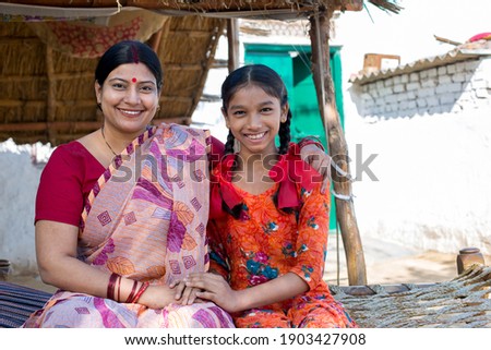 Happy mother with her daughter at village