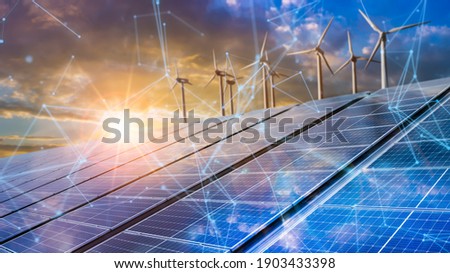 solar cell plant and wind generators in urban area connected to smart grid.Energy supply,eolic turbine,distribution of energy,Powerplant,energy transmission, high voltage supply concept. Royalty-Free Stock Photo #1903433398