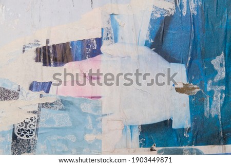 Old torn street posters. Abstract background. Artistic texture.
