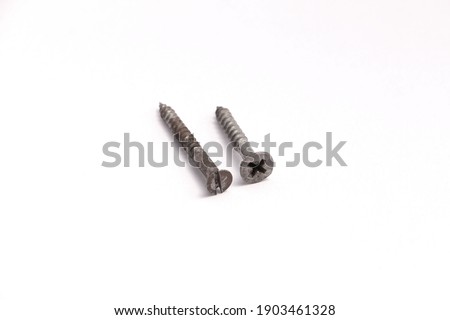 Closeup metal screws, two screws isolate on white background