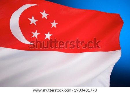 Flag of Singapore - first adopted in 1959, the year Singapore became self-governing within the British Empire. It was reconfirmed as the national flag when the Republic gained independence in 1965.