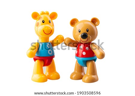 Children's plastic toy - yellow giraffe and bear on a white background isoated for kids side view