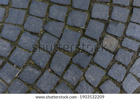Black Basalt natural stone cobblestones. Natural stone plaster texture, textures for graphic design and Photoshop.