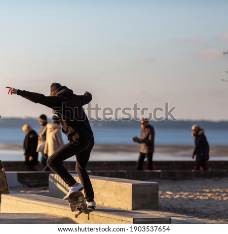 young man skateboarding in skatepark