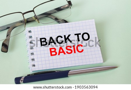 Text Back To Basic on business card with eyeglasses and pen. Concept photo