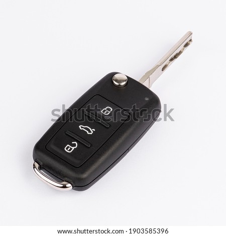 CAR KEY. Black color modern car key on white background.
