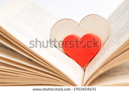 open book with heart symbol inside. love reading concept. valentine day greeting card conceptual.