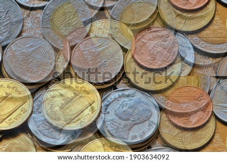 Blurred coins stacking use for business and financial concept background