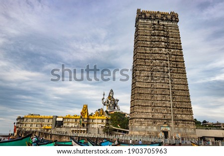 murdeshwar temple early morning view from unique angle image is taken at murudeshwar karnataka india at early morning. it is the house of one of the tallest rajagopuram in the world. Royalty-Free Stock Photo #1903705963