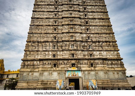 murdeshwar temple rajagopuram entrance with flat sky image is take at murdeshwar karnataka india at early morning. it is one of the tallest gopuram or temple entrance gate in the world. Royalty-Free Stock Photo #1903705969