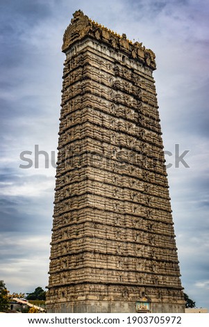 murdeshwar temple rajagopuram entrance with flat sky image is take at murdeshwar karnataka india at early morning. it is one of the tallest gopuram or temple entrance gate in the world. Royalty-Free Stock Photo #1903705972