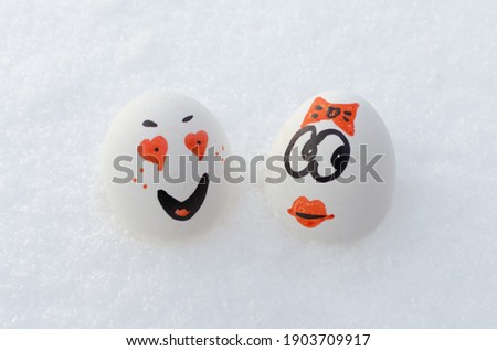 Funny eggs with a painted face in a box. Emotions on eggs.