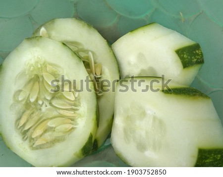 Slices of fresh cucumber showing its seeds