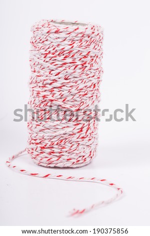 Red and white rope isolated in the studio