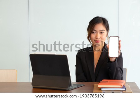 Portrait of female hands showing smartphone.