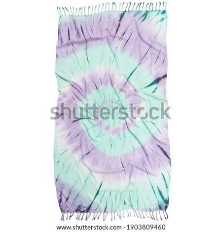 Tie dyed fabric of Turkish towel shibori pattern on fouta. Watercolor painted beach towel isolated on white background.
