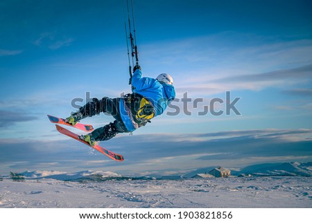 Snowkiting in Storwartz, Røros in Norway. Expedition kiting in snow Royalty-Free Stock Photo #1903821856