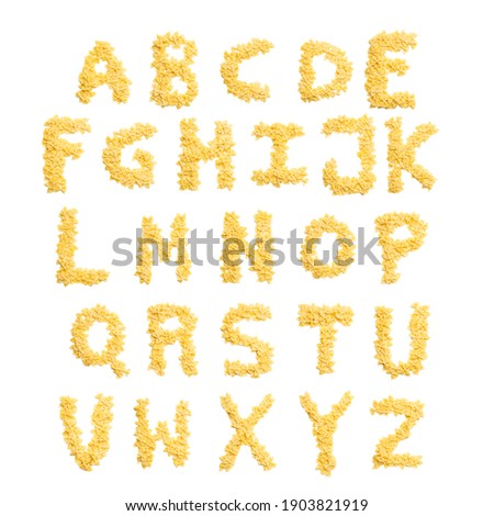  English alphabet from dry farfalle pasta on a white isolated background. Food pattern made from macaroni. Bright alphabet for shops.  Royalty-Free Stock Photo #1903821919