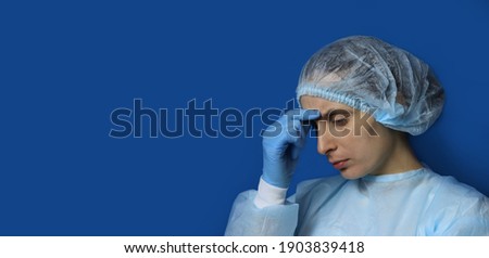 tired young woman doctor or nurse after a hard work. Horizontal banner