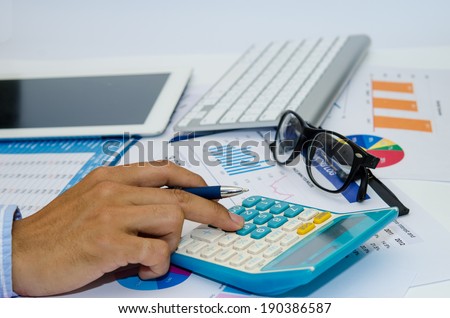Business documents and keyboard placed on desks.