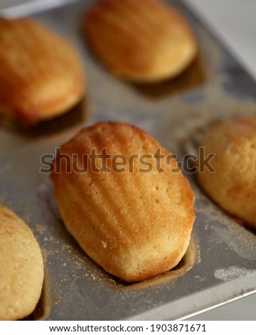 Short, plump little cakes called madeleines. Typical French sweet, famous thanks to writer Marcel Proust.
