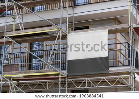 
Printed banner on the scaffolding Royalty-Free Stock Photo #1903884541