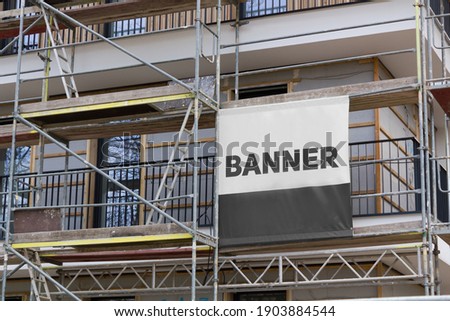 
Printed banner on the scaffolding