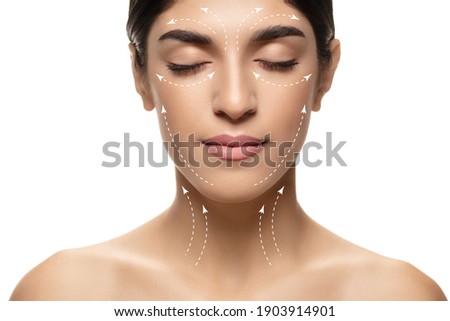 Beautiful female face with lifting up arrows isolated on white background. Concept of bodycare, cosmetics, skincare, correction surgery, beauty and perfect skin. Flyer for your ad. Antiaging. Royalty-Free Stock Photo #1903914901
