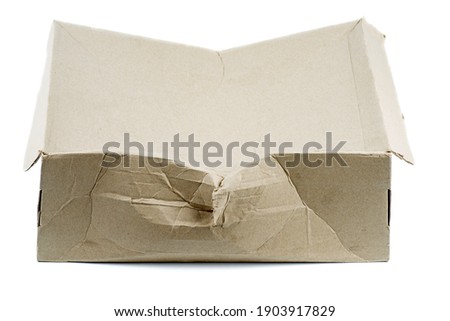 Damaged cardboard box isolated on white background Royalty-Free Stock Photo #1903917829
