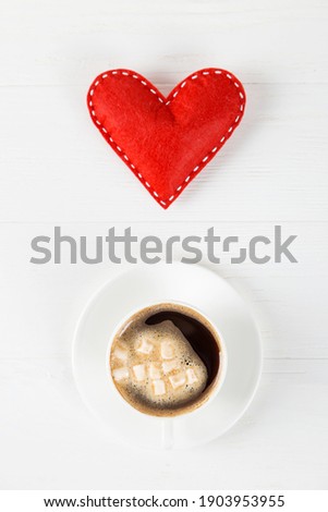 Red heart, morning coffee against the background of a white table, concept, a postcard for Valentine's Day. Copy space.