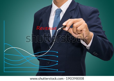 business hand writing revenue graph 