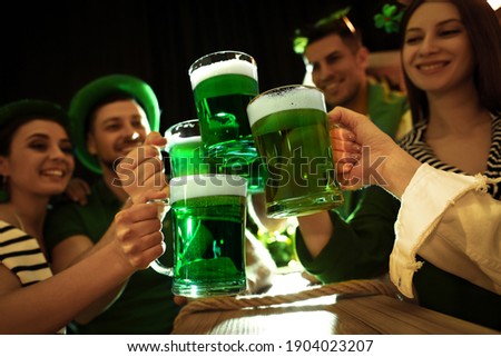 People with beer celebrating St Patrick's day in pub Royalty-Free Stock Photo #1904023207