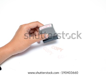 Hand with rubber stamp
